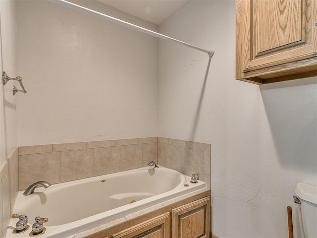 bathroom with a bathing tub and toilet