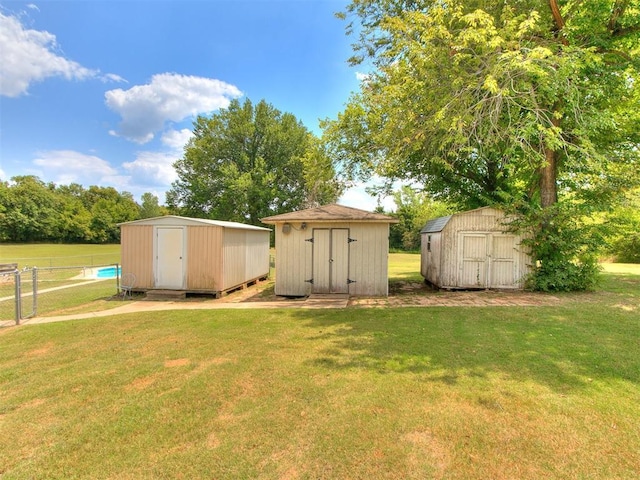 view of outbuilding featuring a lawn