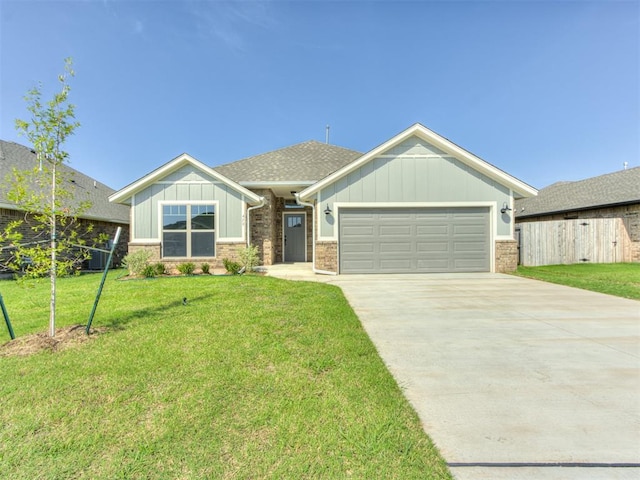 craftsman inspired home with a garage and a front yard