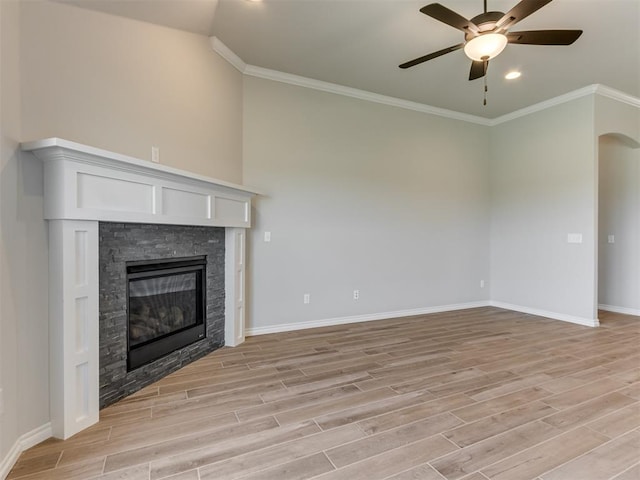 unfurnished living room with a fireplace, light hardwood / wood-style flooring, and ornamental molding