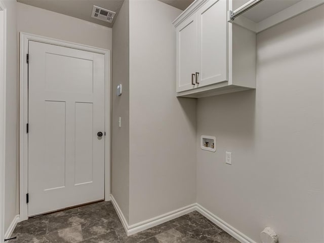 laundry room featuring cabinets and washer hookup