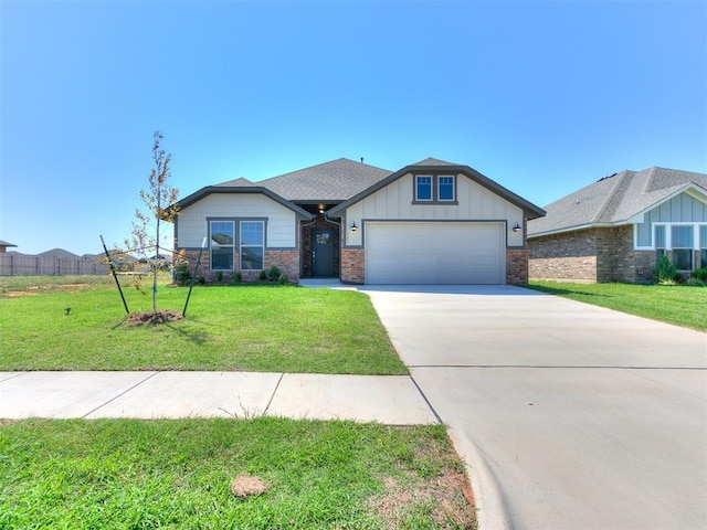 view of front facade with a garage and a front yard