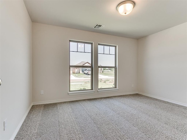 unfurnished room featuring carpet flooring