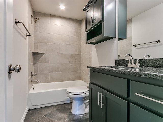 full bathroom with vanity, tiled shower / bath combo, toilet, and tile patterned flooring