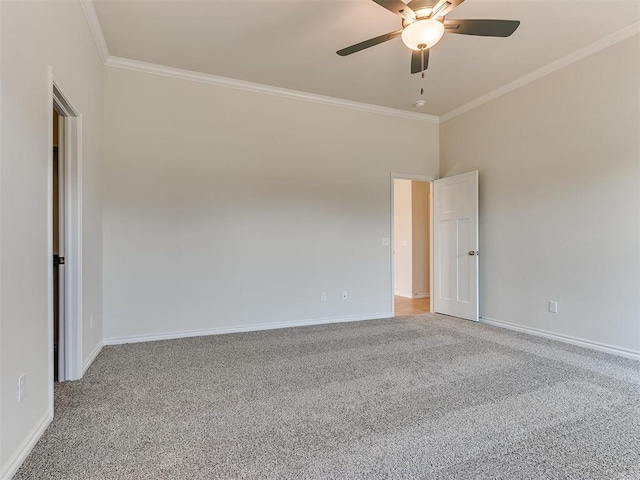 carpeted empty room featuring ceiling fan and ornamental molding