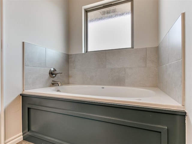 bathroom featuring a tub to relax in