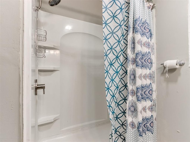 bathroom with curtained shower