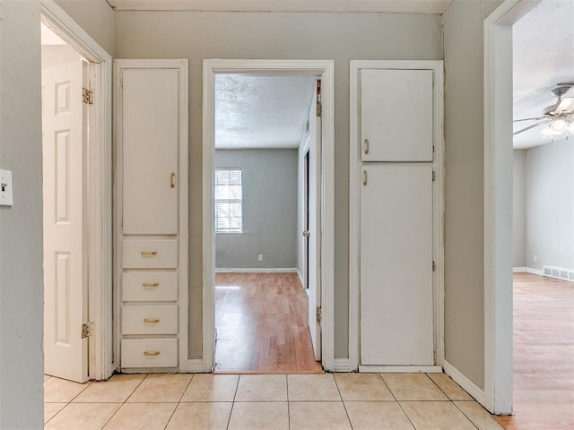 hallway with light wood-type flooring