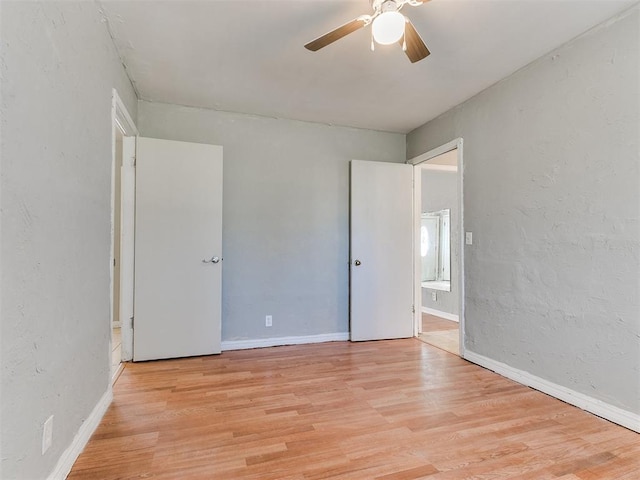 unfurnished room featuring ceiling fan and light hardwood / wood-style flooring