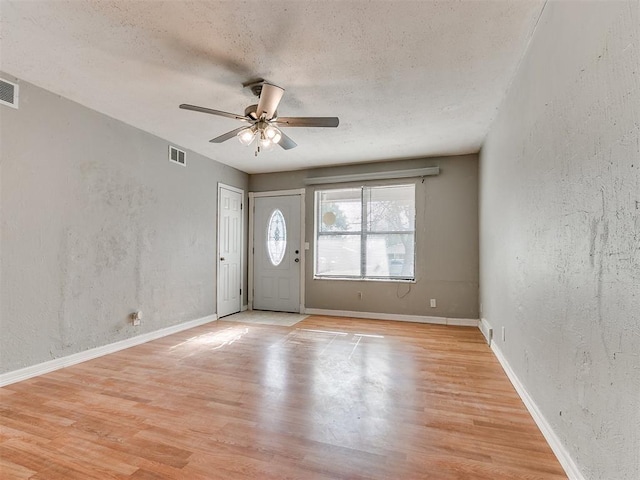 entryway featuring ceiling fan and light wood-type flooring