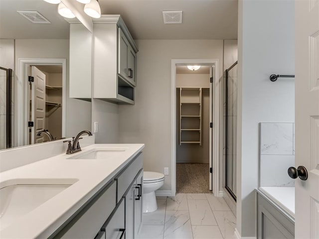 full bathroom featuring plus walk in shower, vanity, and toilet