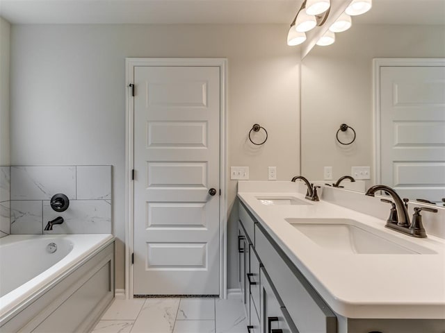 bathroom with vanity and a tub