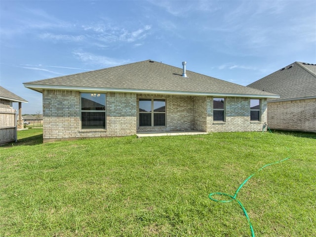 rear view of house with a lawn