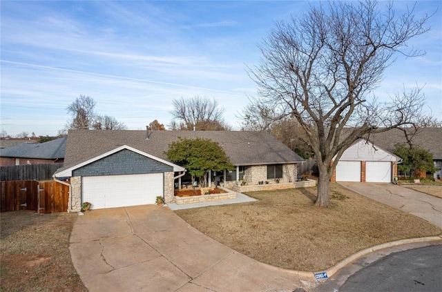 single story home with a garage and a front lawn