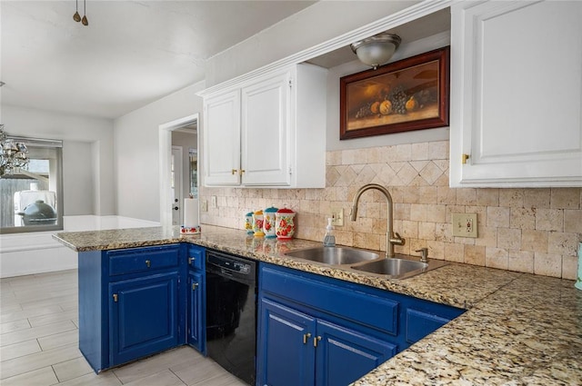 kitchen with white cabinets, dishwasher, blue cabinets, and sink