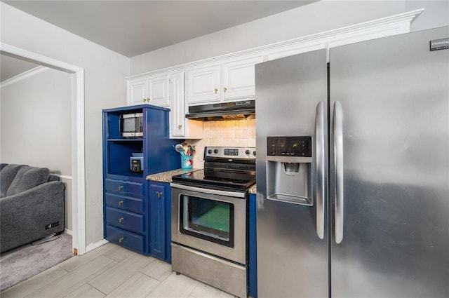 kitchen with blue cabinetry, white cabinetry, backsplash, light hardwood / wood-style floors, and appliances with stainless steel finishes