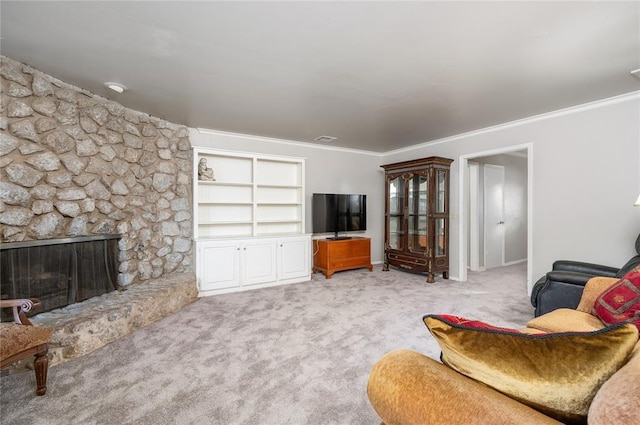 carpeted living room featuring crown molding and a fireplace