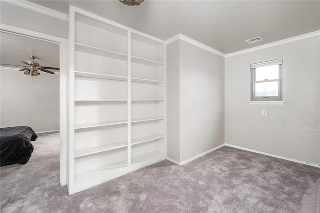 interior space featuring ceiling fan and crown molding