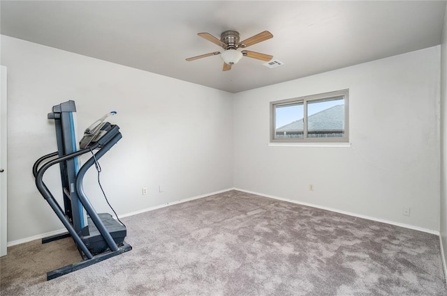 workout area with carpet and ceiling fan