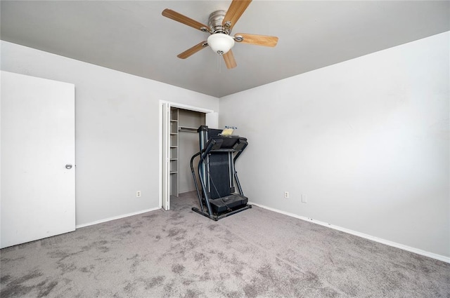 exercise area with light carpet and ceiling fan