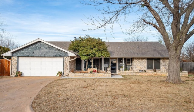 ranch-style home with a front yard and a garage