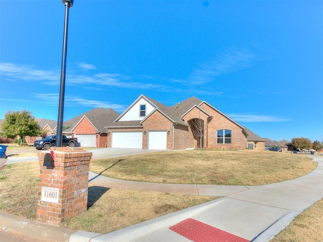 view of front of home with a garage and a front yard