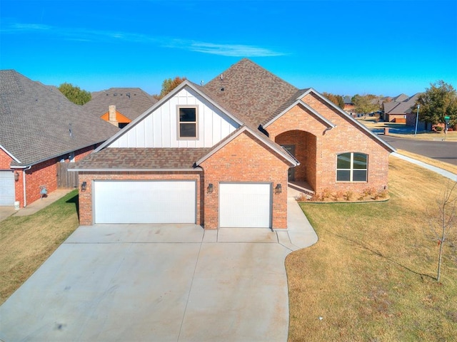 view of front facade with a garage and a front lawn