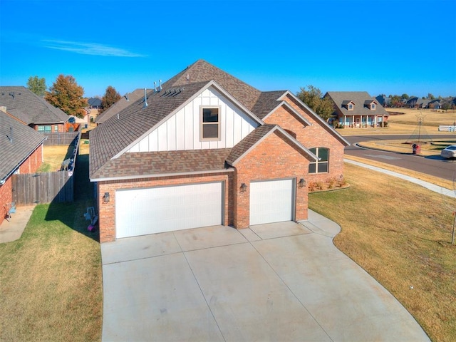 view of front of home featuring a garage and a front yard