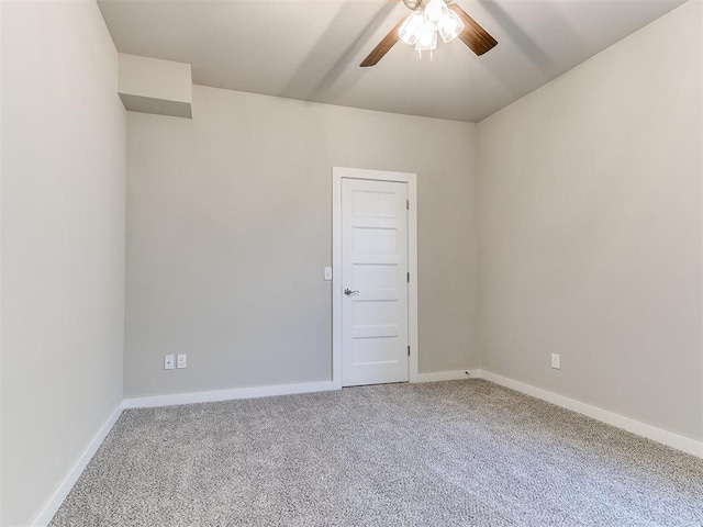 spare room featuring carpet flooring and ceiling fan