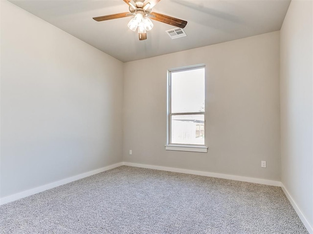 carpeted empty room with ceiling fan