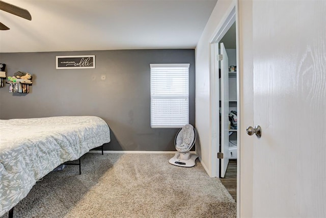 bedroom with carpet, a ceiling fan, and baseboards