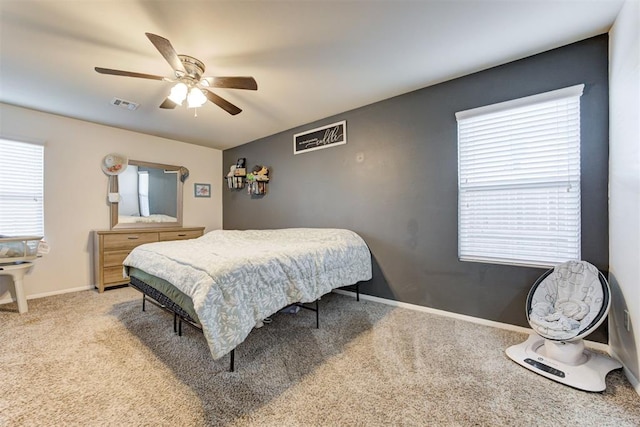 bedroom featuring carpet, visible vents, ceiling fan, and baseboards