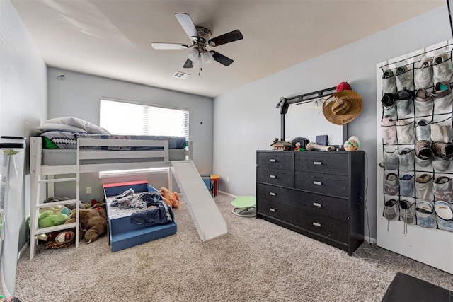 bedroom with ceiling fan, carpet, visible vents, and baseboards