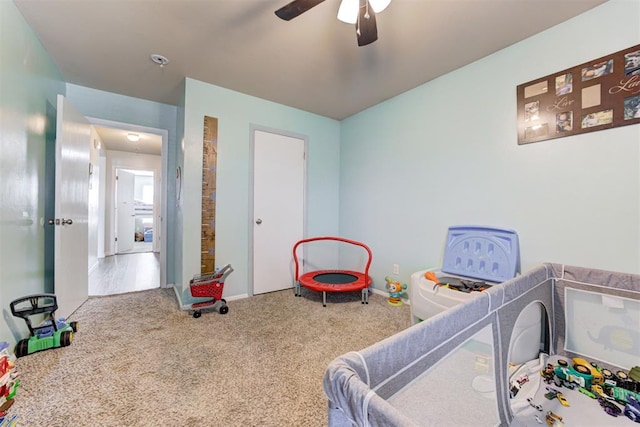 carpeted bedroom featuring a ceiling fan