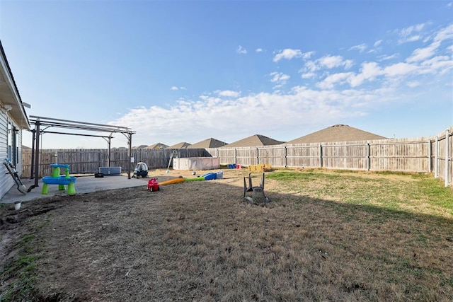 view of yard with a patio area and a fenced backyard