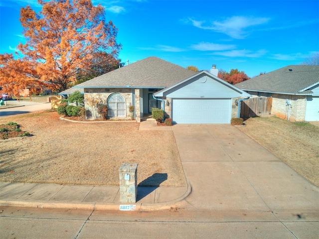 single story home with a garage