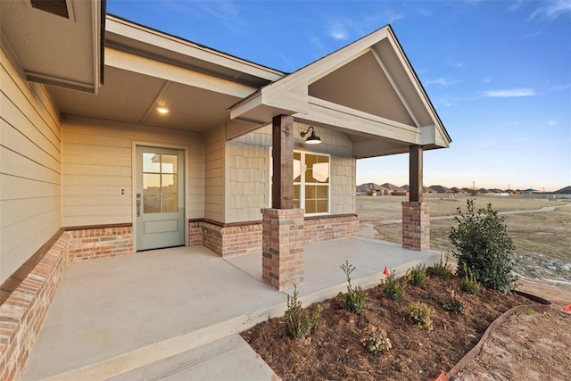 doorway to property featuring a patio area