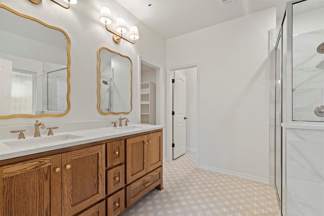 bathroom featuring vanity and a shower with shower door