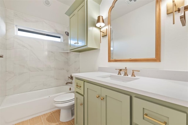 full bathroom featuring vanity, toilet, and tiled shower / bath