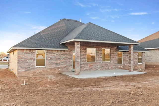 rear view of house featuring a patio