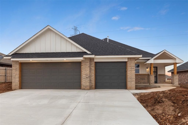 view of front of home with covered porch and a garage