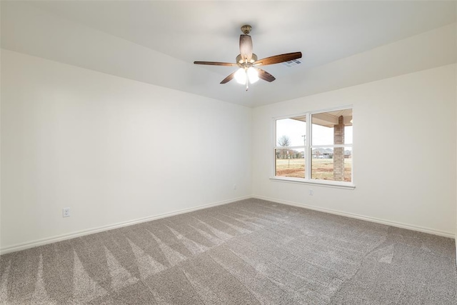 spare room with ceiling fan and carpet floors