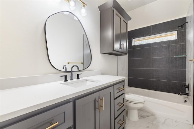 full bathroom with vanity, toilet, and tiled shower / bath