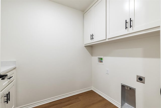 washroom with washer hookup, electric dryer hookup, dark hardwood / wood-style flooring, and cabinets