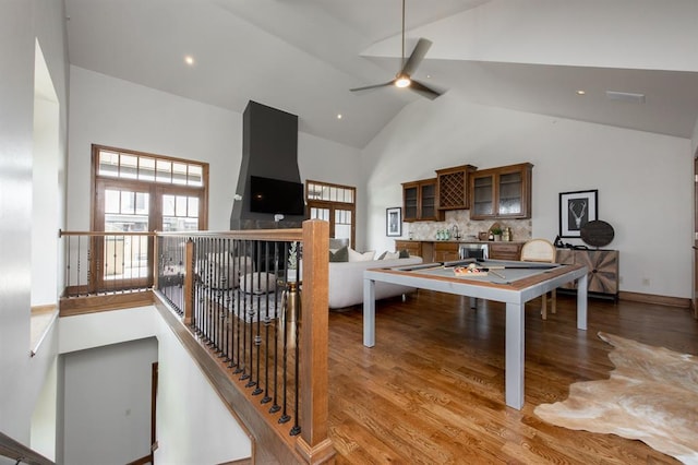 rec room featuring ceiling fan, hardwood / wood-style floors, high vaulted ceiling, and pool table