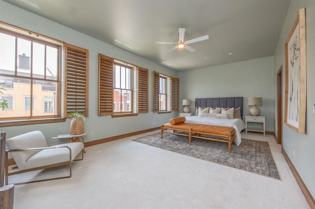 bedroom with ceiling fan and light colored carpet