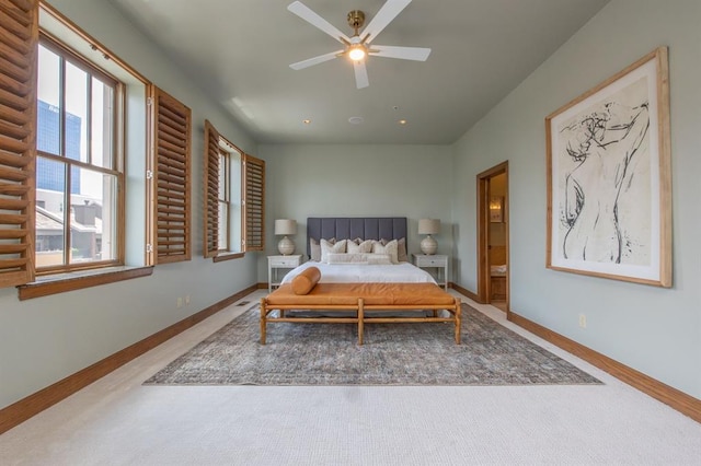 bedroom featuring ceiling fan and connected bathroom