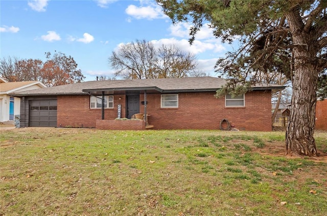 single story home with a front yard, crawl space, brick siding, and an attached garage