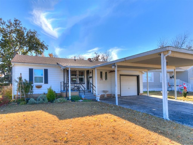 ranch-style house with a front lawn, a carport, a porch, and a garage