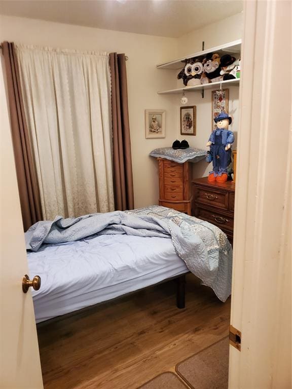 bedroom featuring hardwood / wood-style flooring